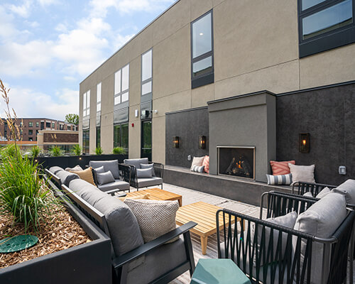 The patio at The Lorient with outdoor couches and fireplaces