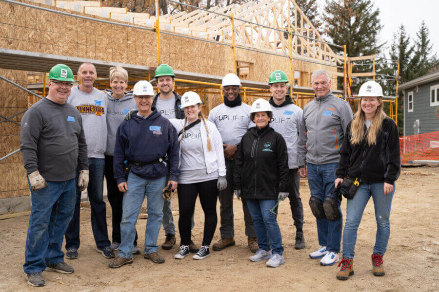 Group of United Properties employees with hardhats