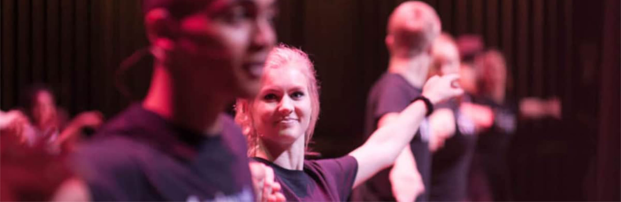 Group of people on stage at a theatre