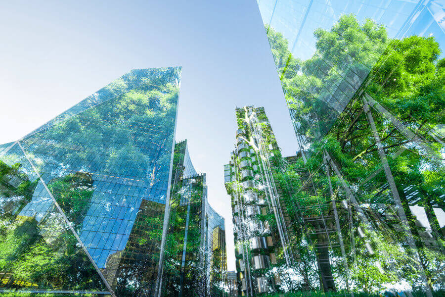 Glass skylines with trees reflecting off