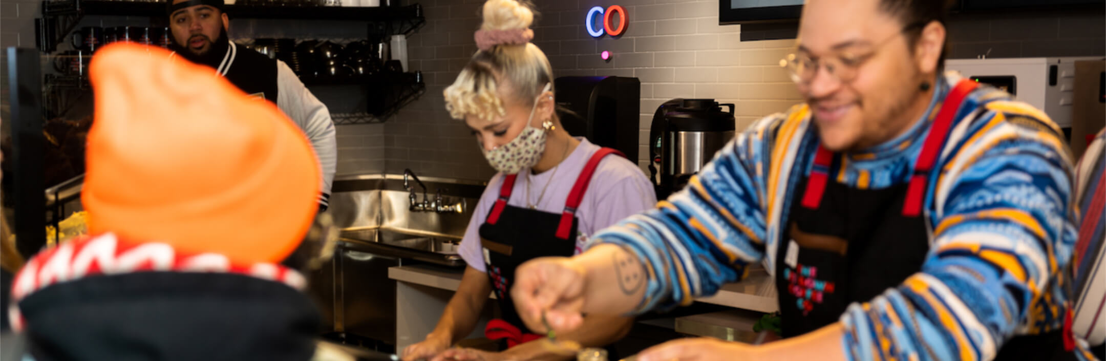 Group of people working at a coffee shop