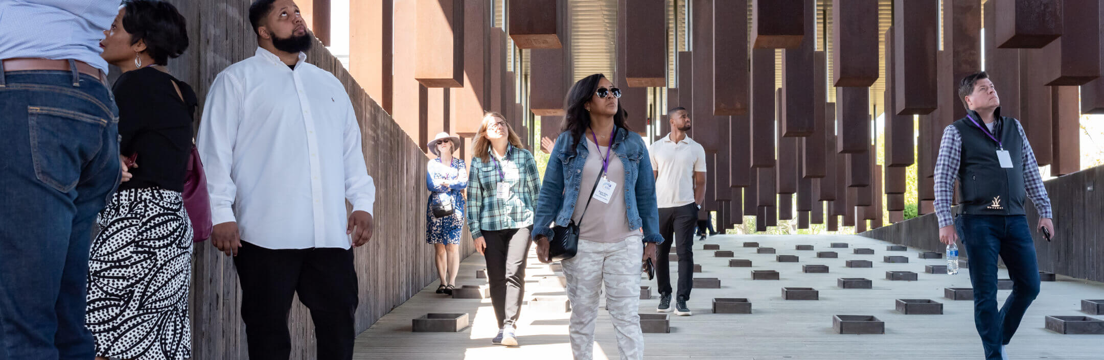 Group of people walking around a building